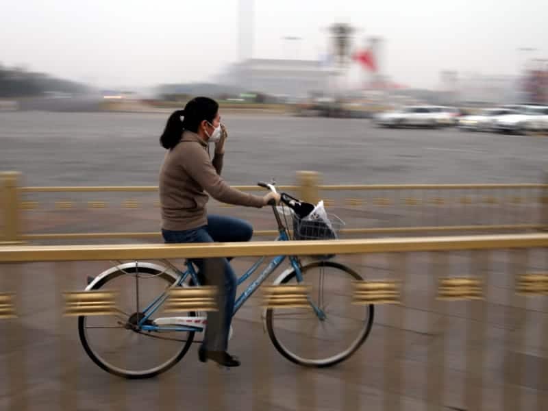 Fahrradfahrerin in Peking, über dts Nachrichtenagentur